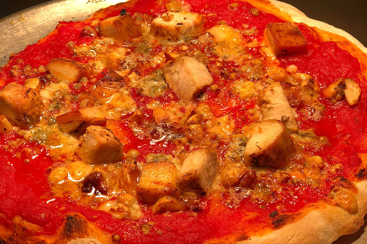Eight Ball Cafe’s chicken Gorgonzola pizza is topped with tomato sauce, roasted chicken, Gorgonzola cheese and roasted garlic. The veteran-owned family restaurant opened Sept. 17 on Colby Avenue in Everett. (Rachid Ayouni)