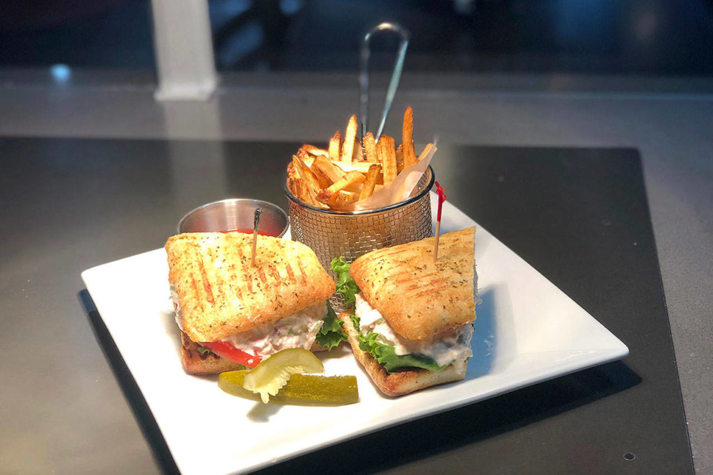Eight Ball Cafe’s tuna sandwich is served with albacore, sliced tomatoes, mayonnaise and green leaf lettuce on focaccia bread. (Rachid Ayouni)
