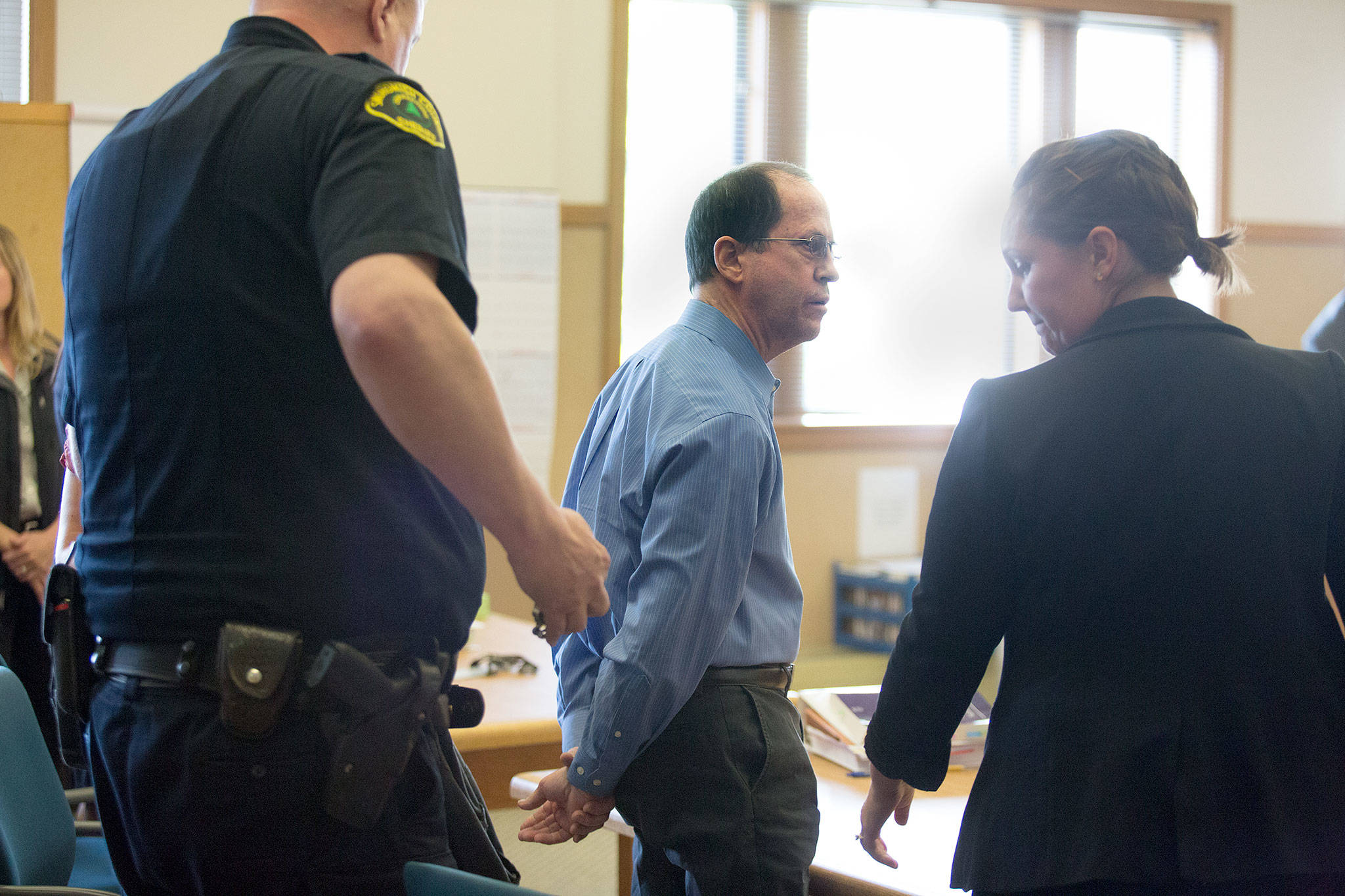 Wayne Alpert waits to be placed in handcuffs at the Snohomish County Courthouse in Everett on Sept. 11 after being found guilty in the 2017 shooting death of a man and the assault of another. (Andy Bronson / The Herald)