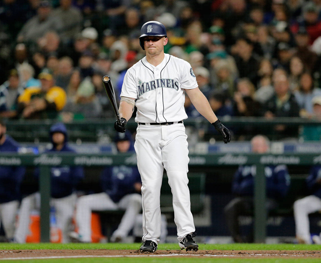 Seattle’s Kyle Seager tosses his bat after striking out during a Sept. 24 game at Safeco Field. (AP Photo/John Froschauer)