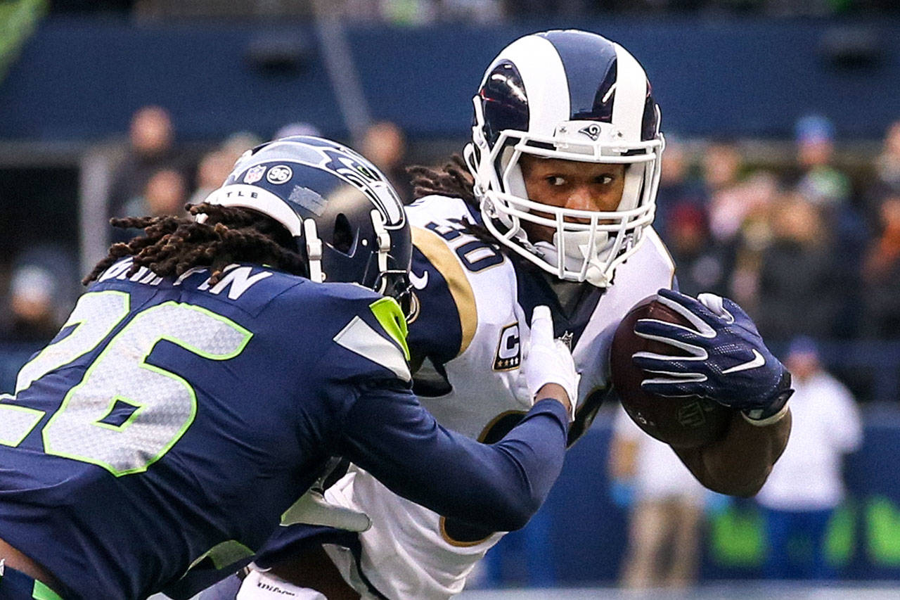 Seahawks cornerback Shaquill Griffin attempts to tackle Rams running back Todd Gurley during the Rams’ 42-7 win on Dec. 17, 2017, in Seattle. (Kevin Clark / The Daily Herald)                                 Seahawks cornerback Shaquill Griffin attempts to tackle Rams running back Todd Gurley II at CenturyLink Field Last December. The Rams won 42-7. (Kevin Clark / The Daily Herald)