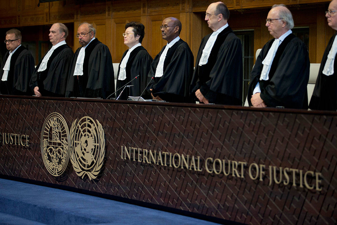 Judges enter the International Court of Justice, or World Court, in The Hague, Netherlands, on Wednesday, where they ruled on an Iranian request to order Washington to suspend U.S. sanctions against Tehran. (AP Photo/Peter Dejong)
