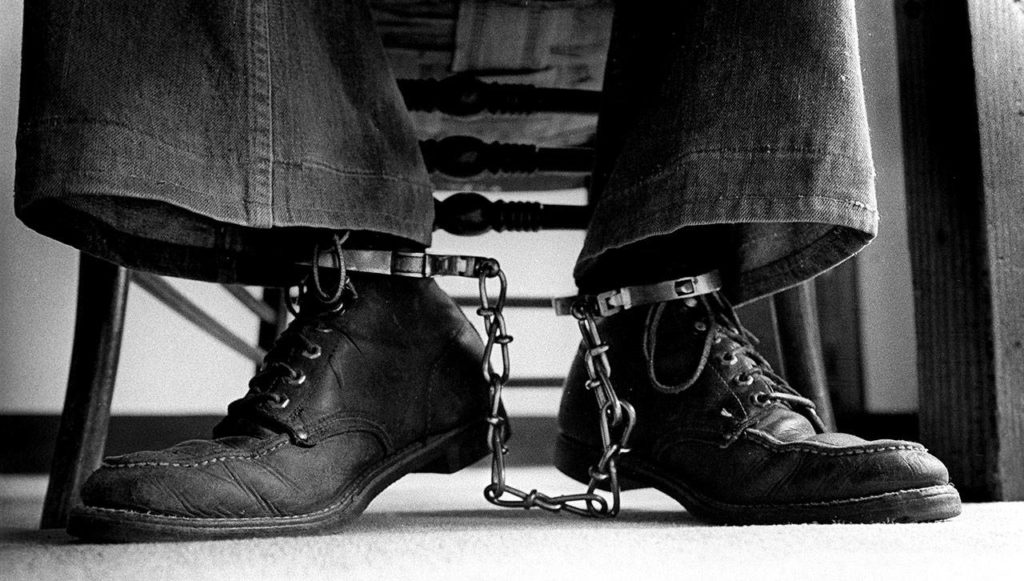 Chained at the ankles, Ted Bundy sits and reads in the Garfield County Jail in Glenwood Springs, Colorado. Bundy escaped from the jail only weeks after Jerry Gay took these photos. (Jerry Gay)
