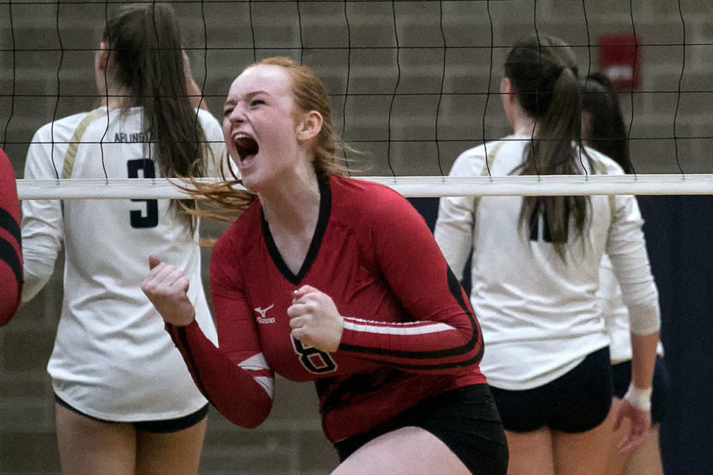 Snohomish’s Grace Raper celebrates a kill Thursday night at Arlington High School on October 4, 2018. (Kevin Clark / The Herald)
