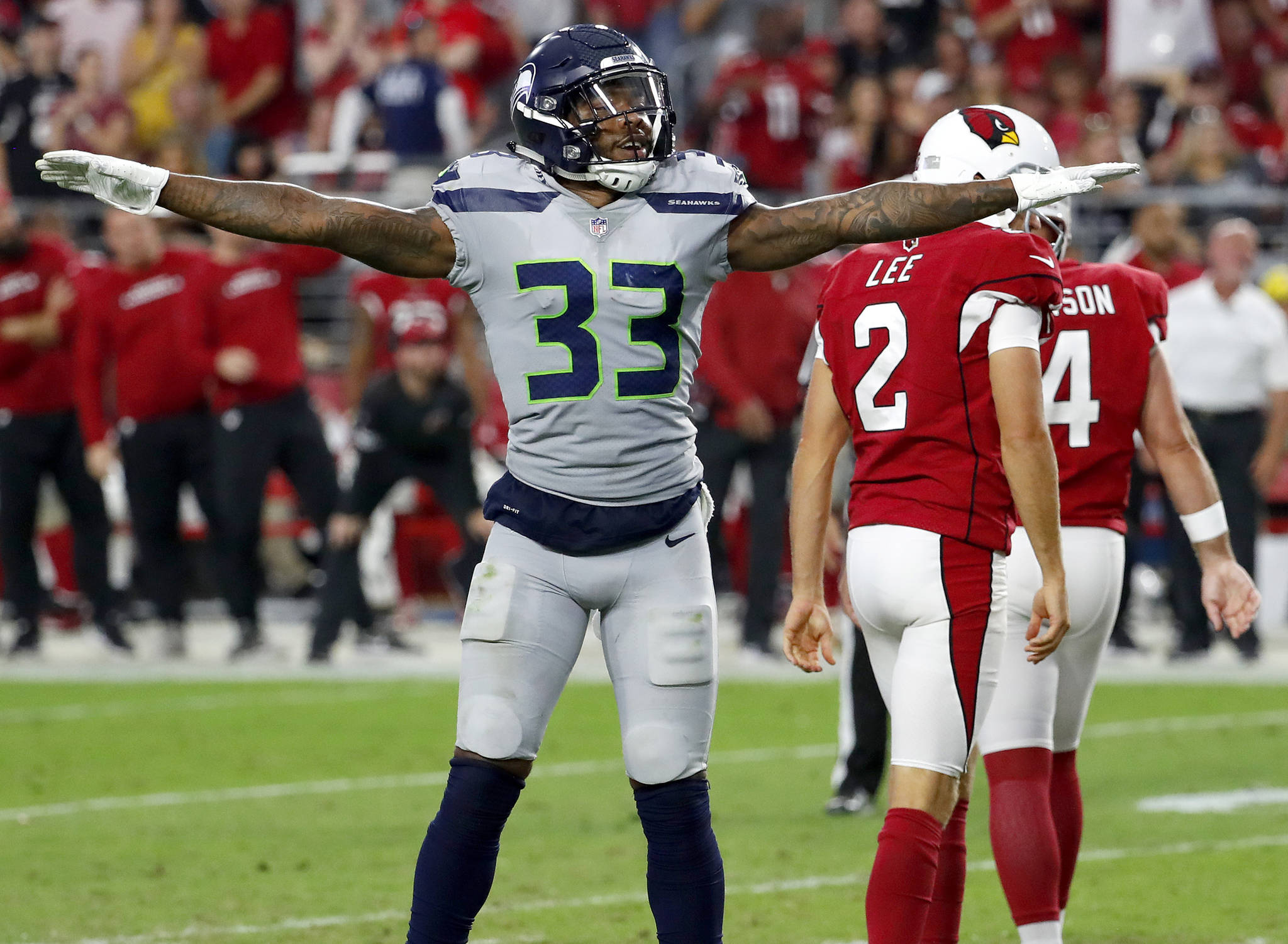 Seattle’s Tedric Thompson celebrates a missed field goal during the second half of a Sept. 30 game in Glendale, Ariz. (AP Photo/Rick Scuteri)