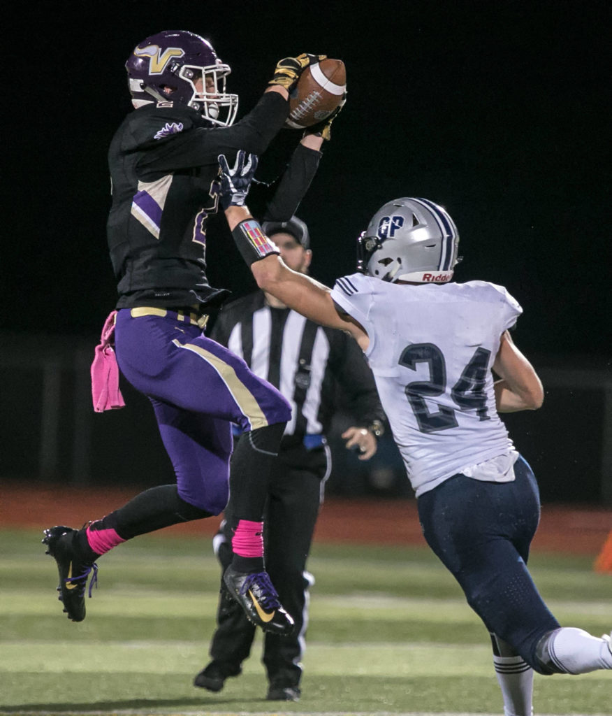 Lake Stevens’ Devin McWaters (left) intercepts a pass intended for Glacier Peak’s Evan Mannes. (Kevin Clark / The Herald)
