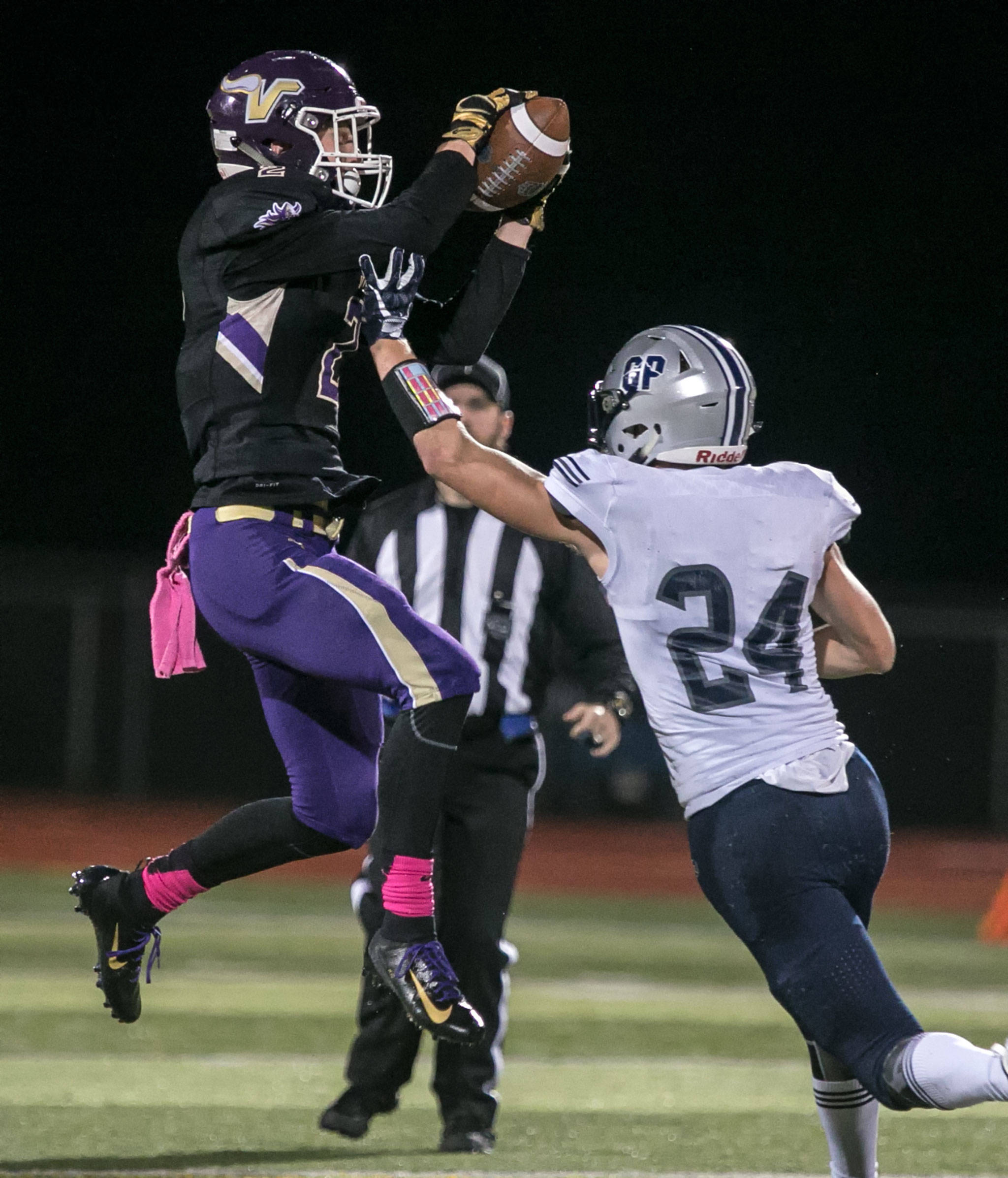 Lake Stevens’ Devin McWaters intercepts a pass intended for Glacier Peak’s Evan Mannes Friday night at Lake Stevens High School on October 5, 2018. (Kevin Clark / The Herald)