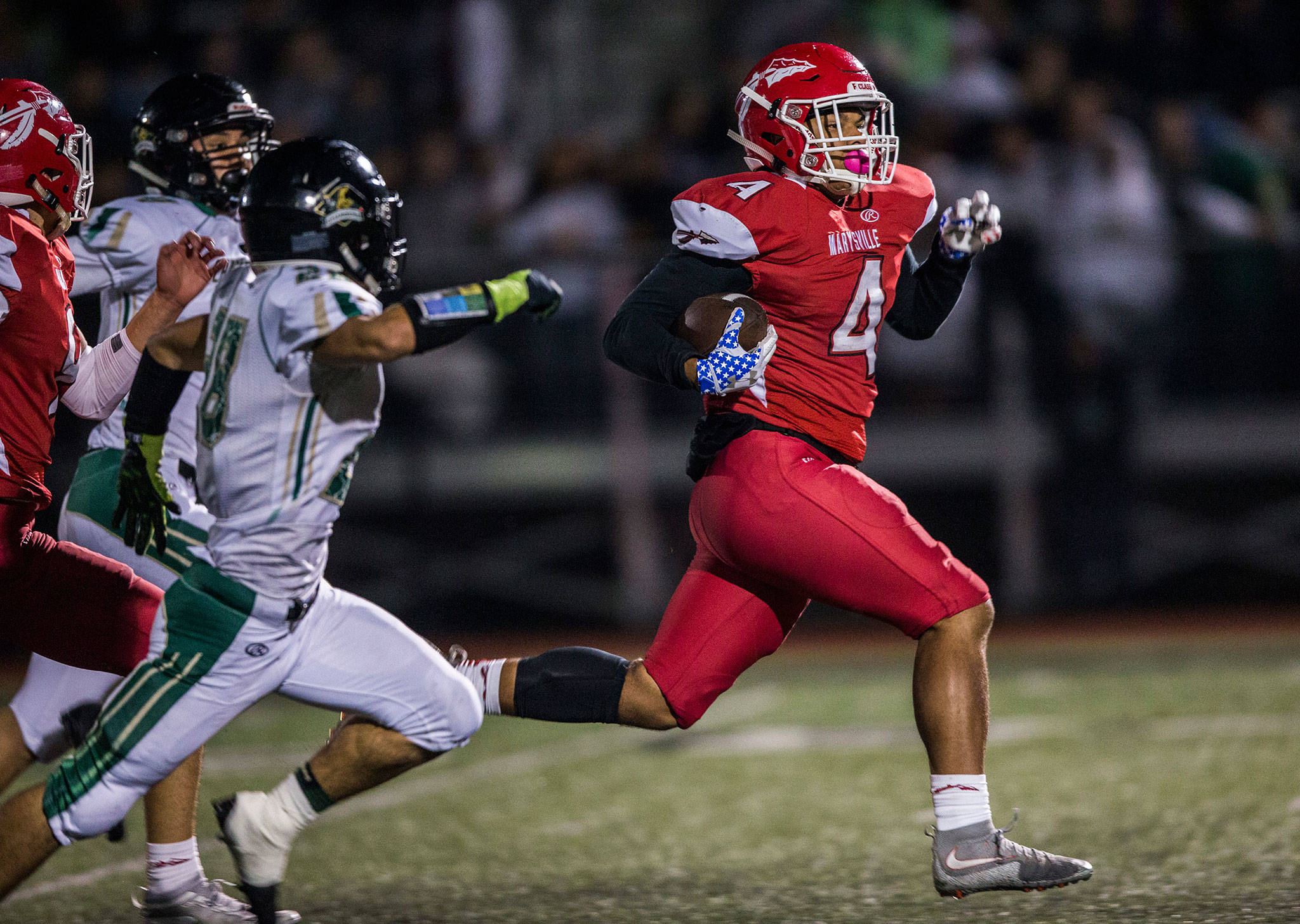 Marysville Pilchuck’s Trenton Hurst runs the ball during the game on Oct. 5 in Marysville. (Olivia Vanni / The Herald)