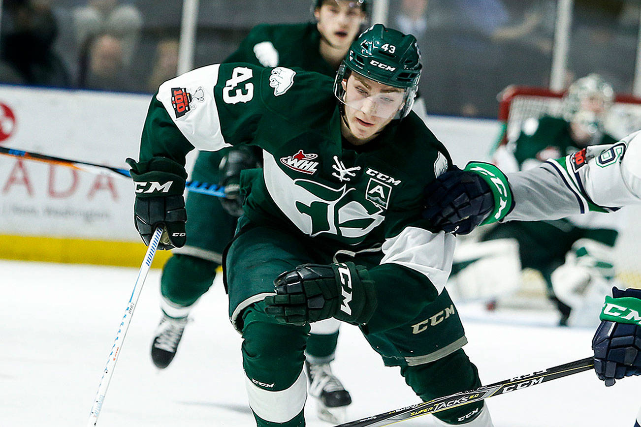 Ian Terry / The Herald Silvertips center Connor Dewar (left) battles for the puck with Seattle’s Noah Philp during a playoff game at Showare Arena in Kent on Tuesday, March 27. Photo taken on 03272018