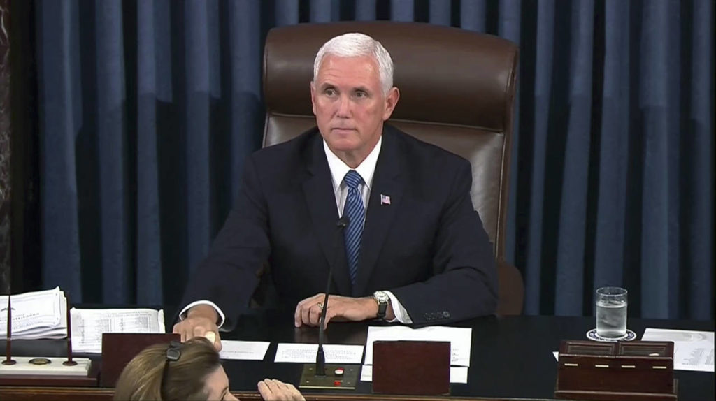 Vice President Mike Pence calls for the Sergeant at Arms to restore order in the Senate gallery as a protester yells during the start of the vote for the confirmation of Brett Kavanaugh to the Supreme Court in Washington. (AP Photo/APTN)
