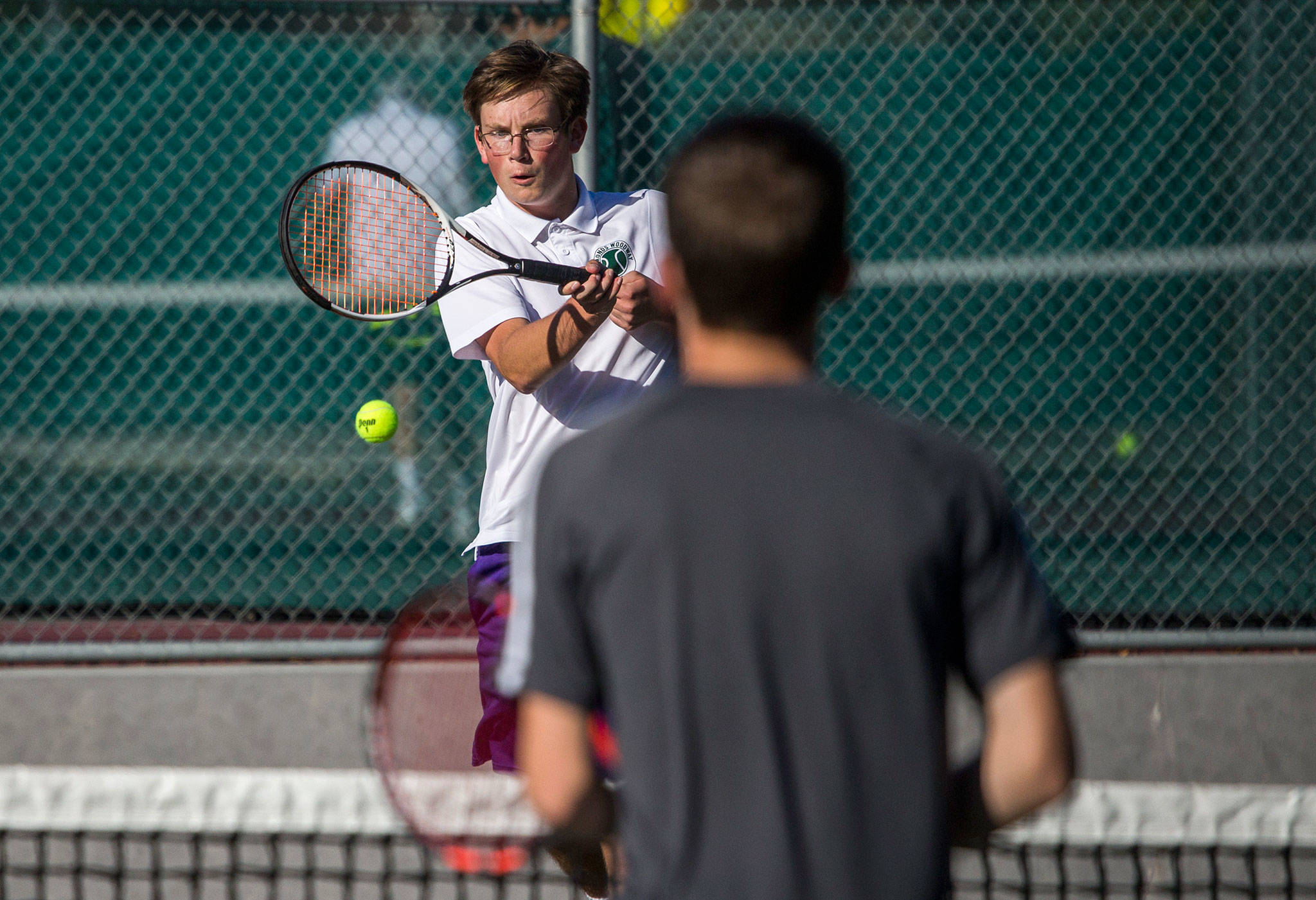 Edmonds-Woodway’s Alec Mutulka hits a return shot during match against Stanwood on Oct. 4, 2018, in Edmonds. (Olivia Vanni / The Herald)