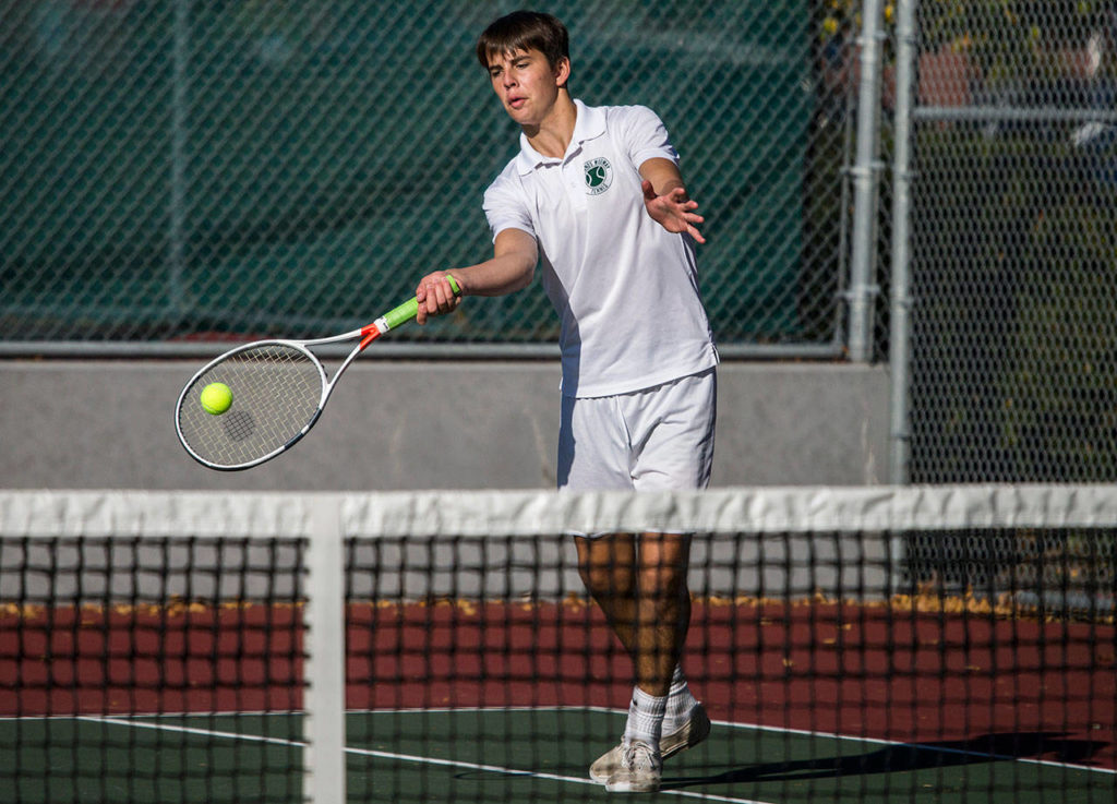 Edmonds-Woodway’s Will Molinaro hits a return shot during match against Stanwood on Oct. 4, 2018, in Edmonds. (Olivia Vanni / The Herald)

