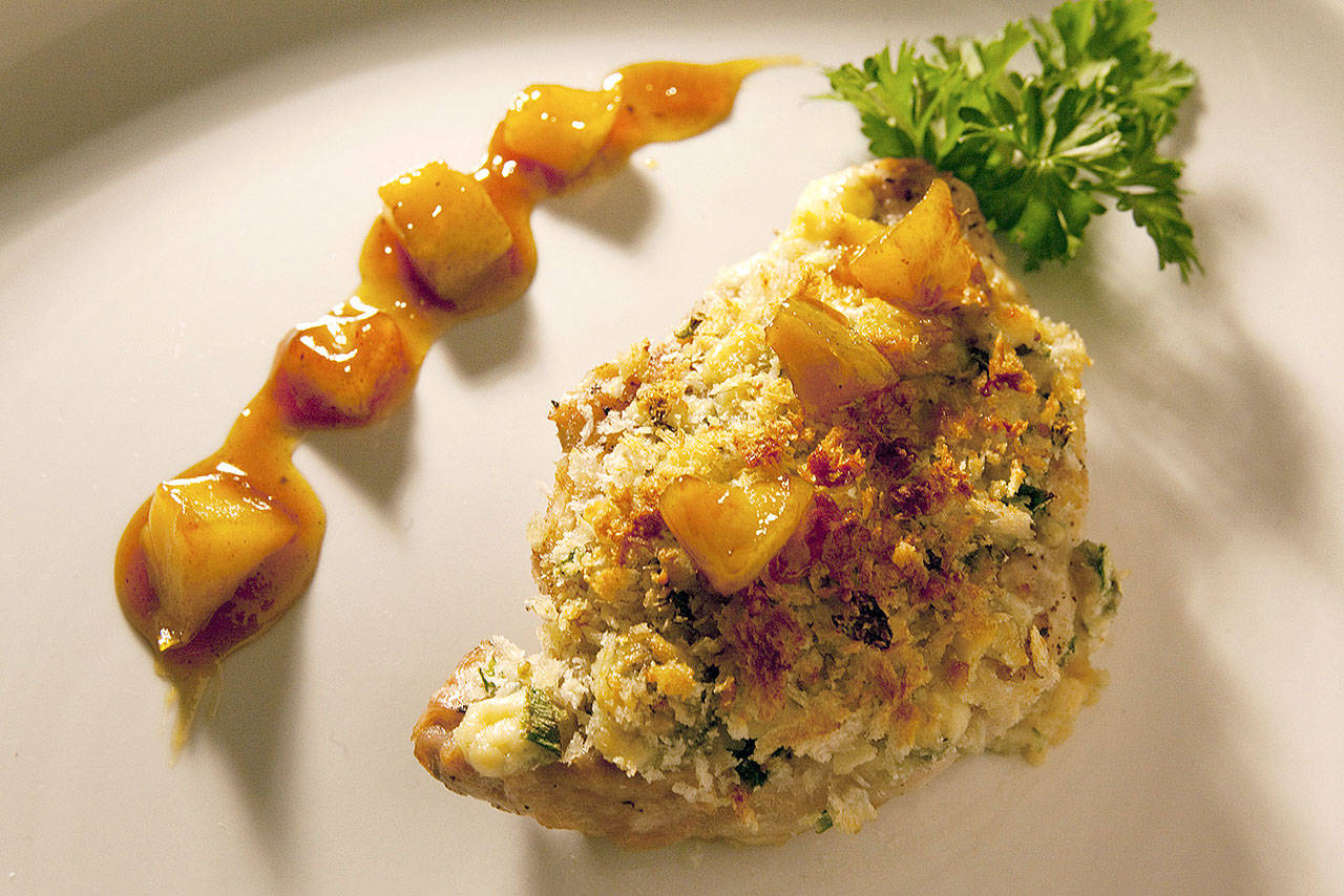 Browned bits of food in the pan add flavor to pork with blue cheese crust and apricot glaze. (Kathleen Galligan/Detroit Free Press)