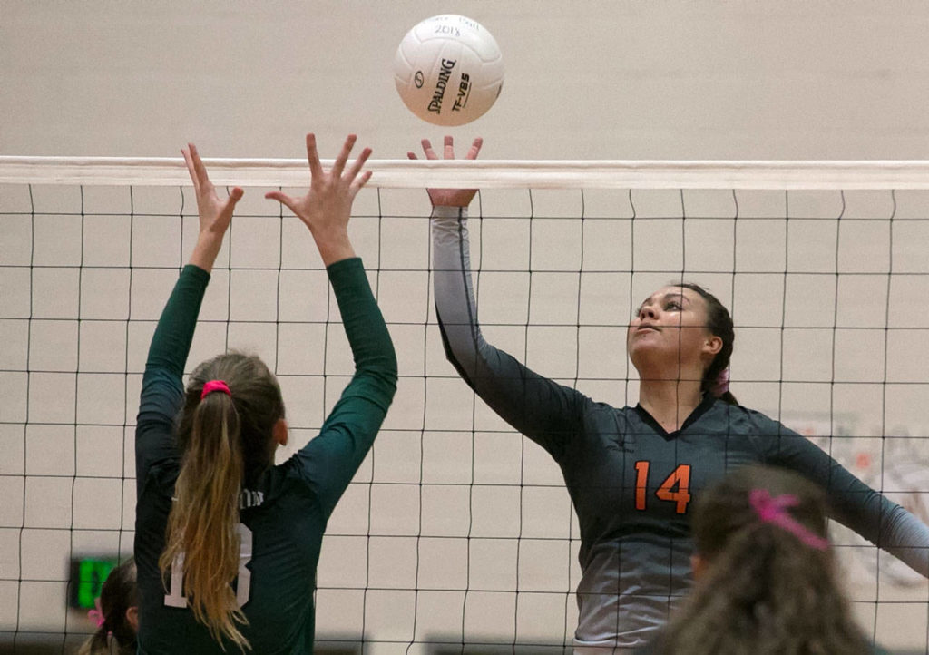 Monroe’s Samantha Zimmerman (14) battles with Jackson’s Ava Doney at the net during a Wesco 4A match Tuesday in Monroe. (Kevin Clark / The Herald)
