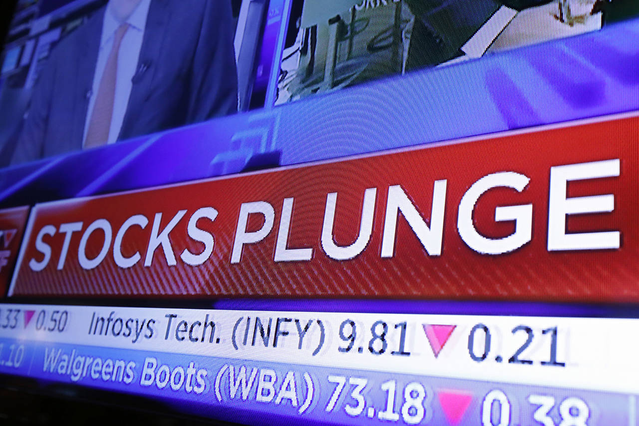 A headline scrolls on a television screen on the floor of the New York Stock Exchange on Wednesday. Stocks are extending their slump on Wall Street, led by drops in big technology companies, as rising bond yields draw investors out of stocks. (AP Photo/Richard Drew)