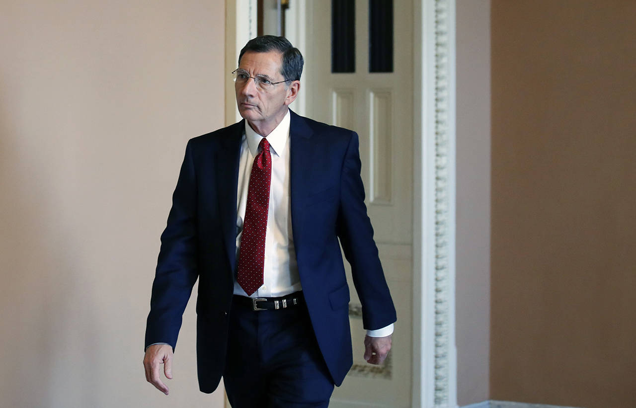 “America needs comprehensive water infrastructure legislation that will cut Washington red tape, create jobs and keep communities safe,” said Sen. John Barrasso, chairman of the Senate Environment and Public Works Committee. Barrasso is seen here heading to the Senate floor on Oct. 3 in Washington. (AP Photo/Alex Brandon)