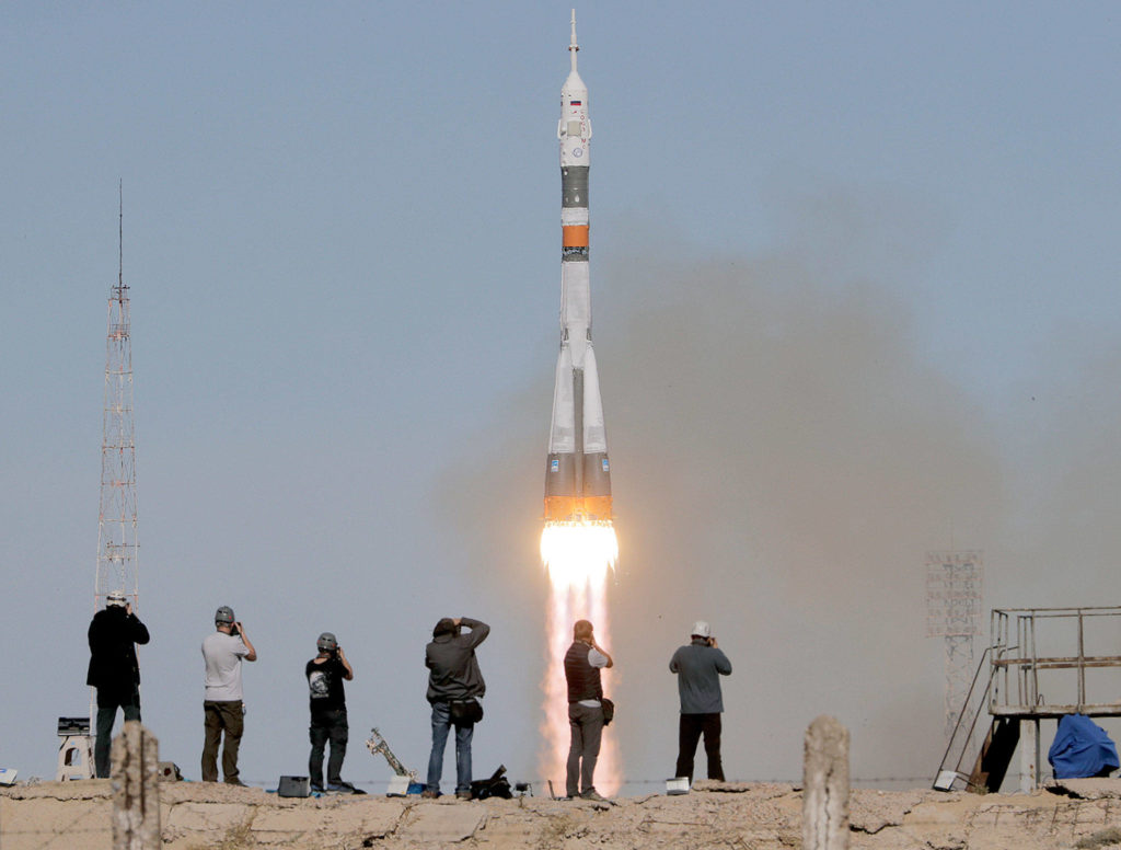 A Soyuz-FG rocket booster with a Soyuz MS-10 spaceship carrying a new crew to the International Space Station blasts off at the Russian-leased Baikonur cosmodrome in Kazakhstan on Thursday. Two astronauts, one from the U.S. and one from Russia, made an emergency landing after the booster failed after launch. (AP Photo/Dmitri Lovetsky) 
