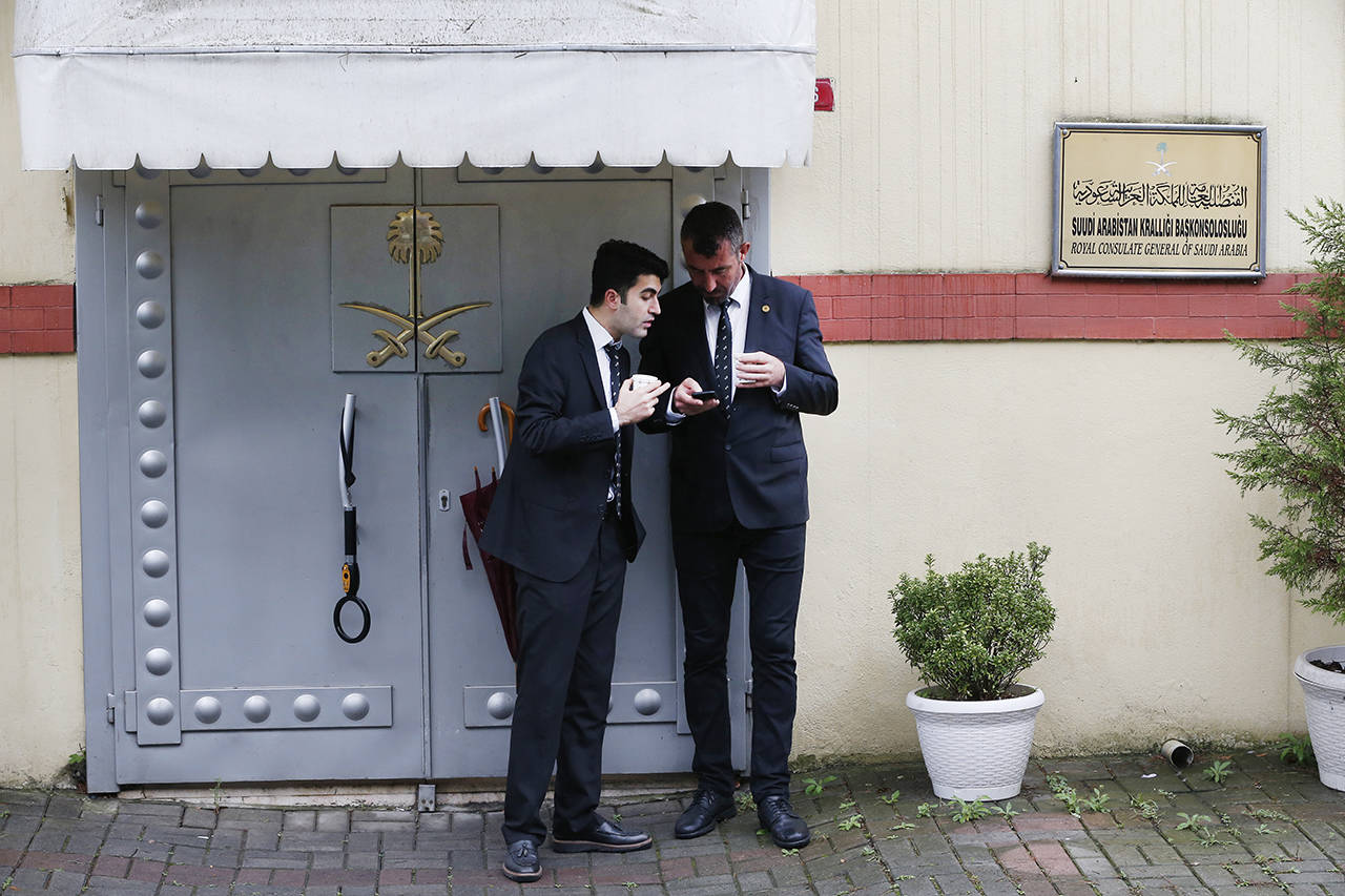 Security guards stand outside Saudi Arabia’s consulate in Istanbul on Thursday. Turkish officials have said they believe Saudi writer and government critic Jamal Khashoggi, was killed inside the consulate after he visited the mission to obtain a document required to marry his Turkish fiancee. (AP Photo/Lefteris Pitarakis)