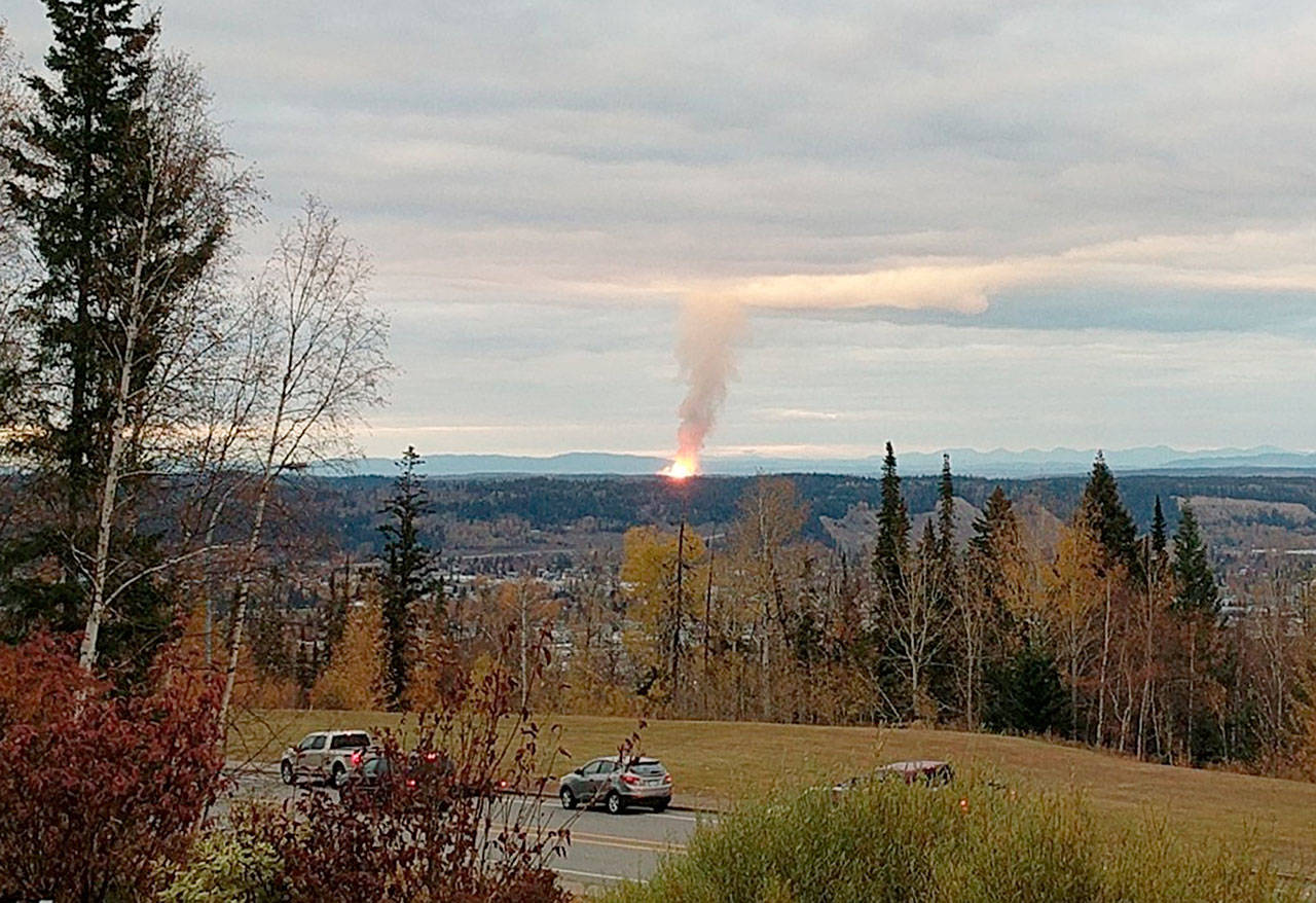 Flames from the explosion of a natural gas pipeline near the community of Shelley, British Columbia. (Dhruv Desai via AP)