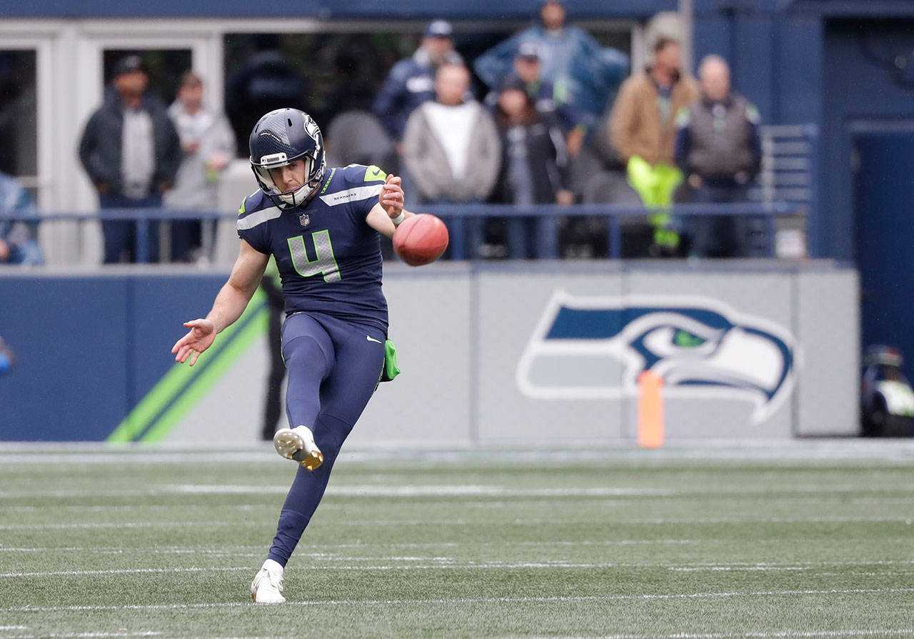 Seattle’s Michael Dickson drop-kicks a kickoff during the second half of an Oct. 7 game at CenturyLink Field. (AP Photo/Elaine Thompson)