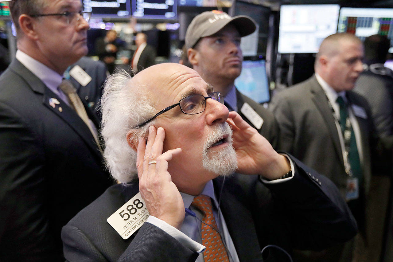 Trader Peter Tuchman on the floor of the New York Stock Exchange Thursday. U.S. stocks sank more than 2 percent. (AP Photo/Richard Drew)