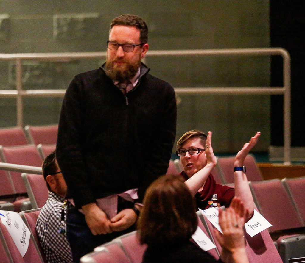 Mandy Manning, the 2018 National Teacher of the Year (right) applauds Robert Hand, as the 2019 Washington state Teacher of the Year is introduced. (Dan Bates / The Herald)
