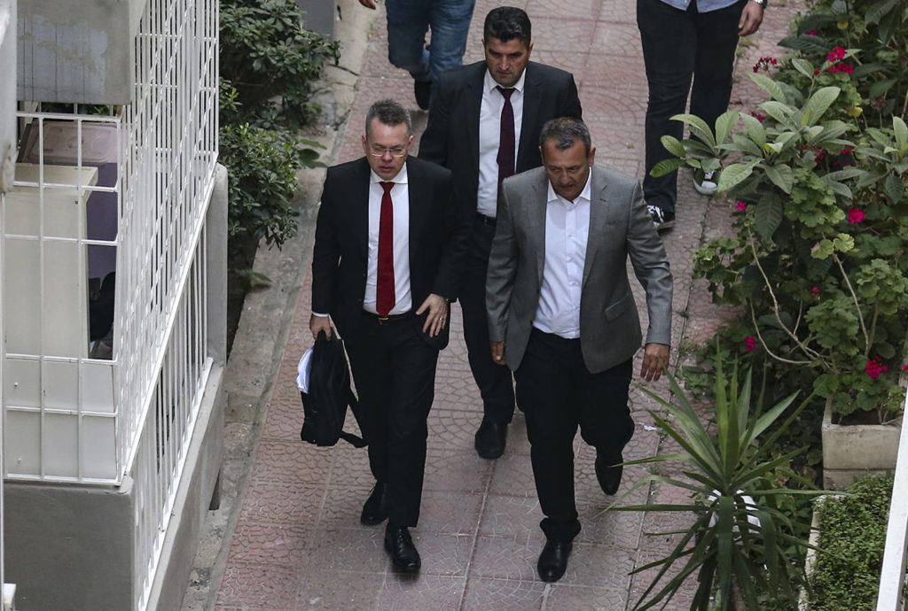 U.S. Pastor Andrew Brunson (front left) arrives at home after his release, following his trial in Izmir, Turkey, on Friday. (AP Photo/Emre Tazegul)
