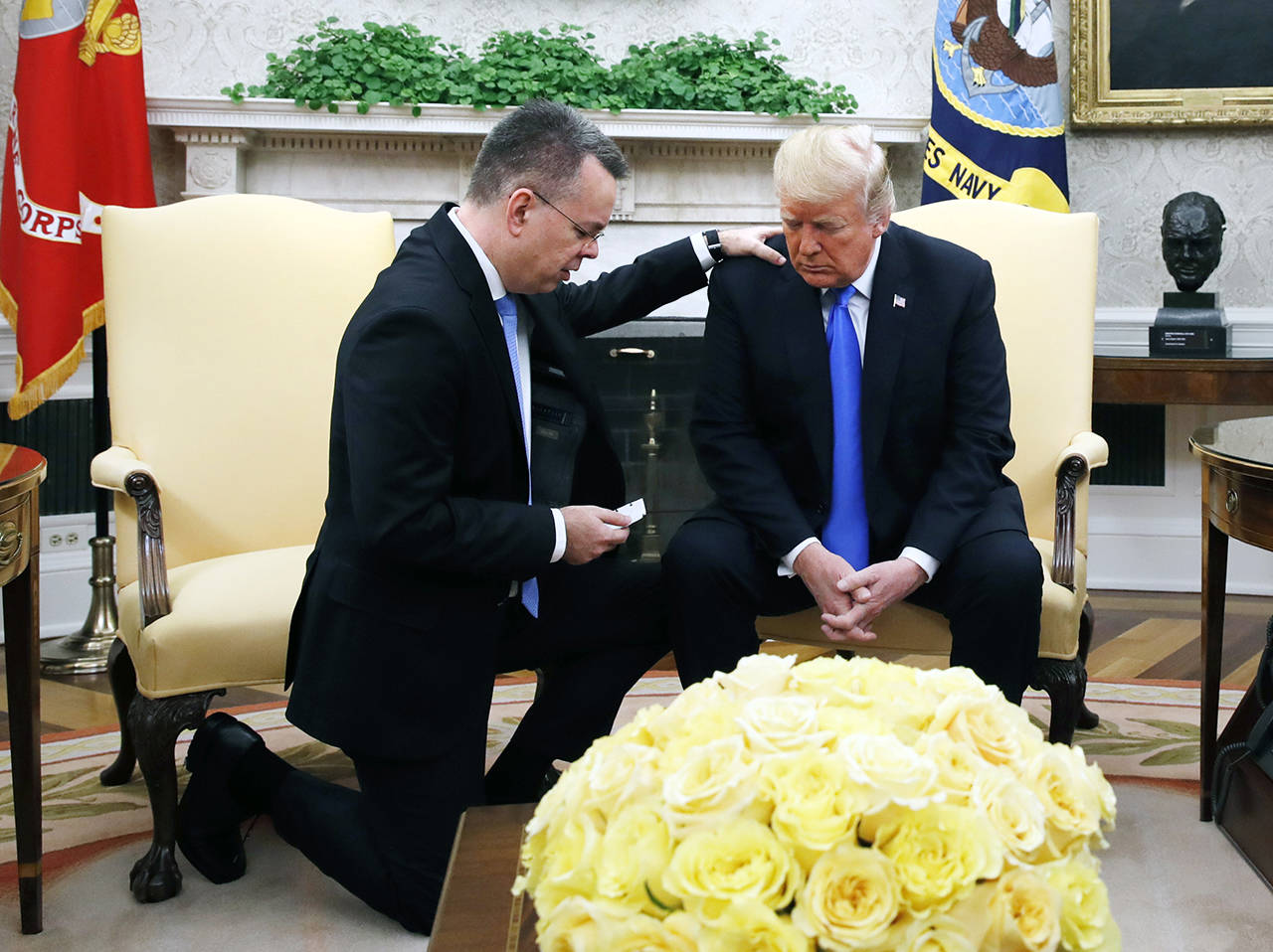 President Donald Trump prays with American pastor Andrew Brunson in the Oval Office of the White House on Saturday on Washington. Brunson returned to the U.S. around midday after he was freed Friday, from nearly two years of detention in Turkey. (AP Photo/Jacquelyn Martin)