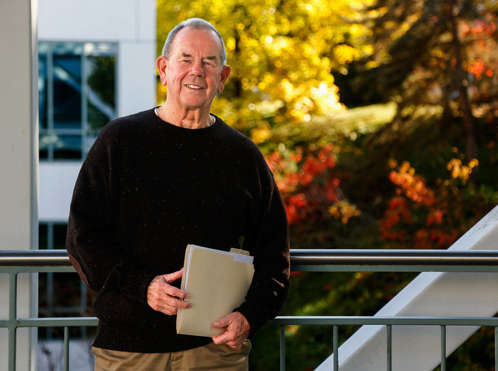 Everett historian Larry O’Donnell carries a folder of photos and words he has compiled while writing a biography of Victor Sumio Hirakawa, a Japanese-American member of his Everett High School class of 1955. (Dan Bates / Herald Photographer)
