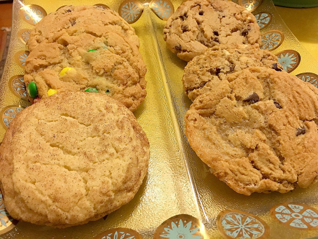 Midnight Cookie Co. offers 13 varieties of cookies, everything from chocolate chip to s’mores, a seasonal chef’s special and vegan, that range between $1.75 and $1.95 each. All are baked at its production center at the Everett location. (Ben Watanabe / The Herald)
