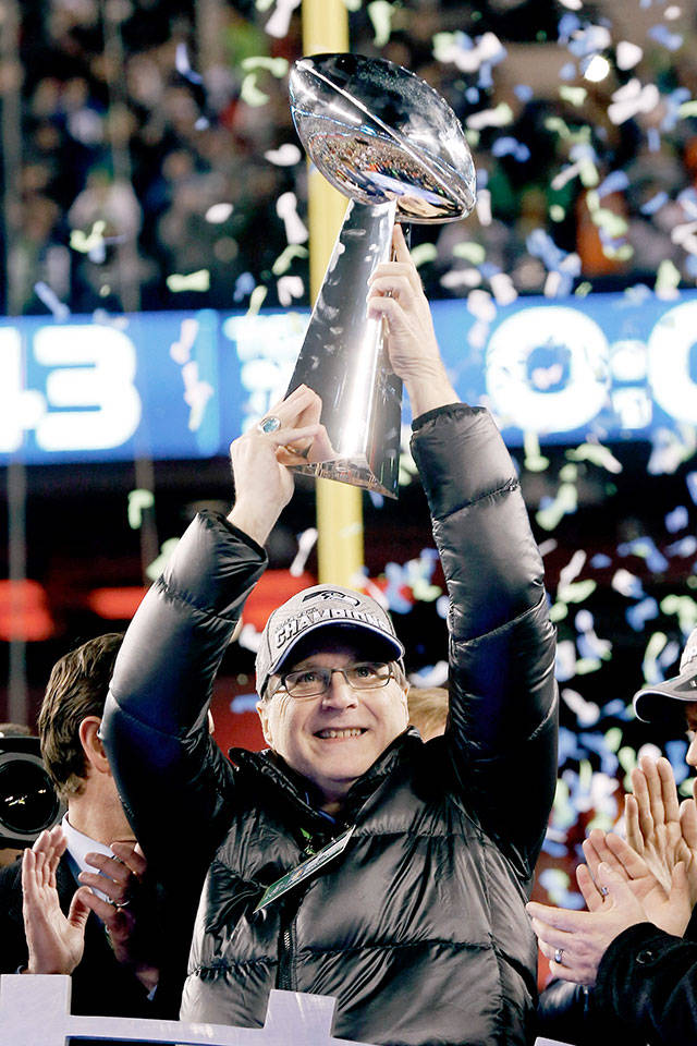 Seattle Seahawks owner Paul Allen holds the the Vince Lombardi Trophy in 2014 after NFL Super Bowl XLVIII against the Denver Broncos in East Rutherford, New Jersey. The Seahawks won 43-8. (AP Photo/Paul Sancya, File)
