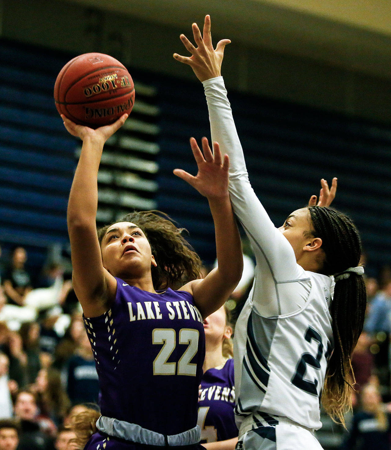 Lake Stevens’ Raigan Reed (left) goes up for a shot as Glacier Peak’s Alexyss Newman (right) defends during a game at Glacier Peak High School in Snohomish on Friday, Jan. 19, 2018. Reed, a junior, has given her verbal commitment to join the Boise State University women’s basketball team. (Ian Terry / The Herald)