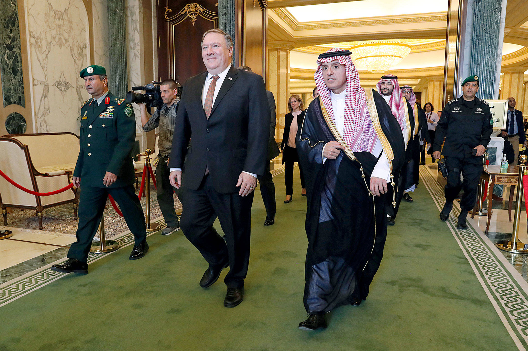 U.S. Secretary of State Mike Pompeo walks with Saudi Foreign Minister Adel al-Jubeir in Riyadh, Saudi Arabia, on Tuesday. (Leah Millis/Pool via AP)