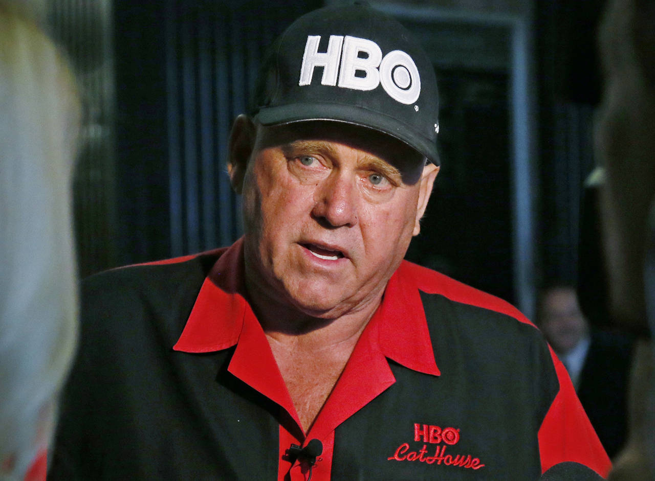 In this 2016 photo, Dennis Hof, owner of the Moonlite BunnyRanch, a legal brothel near Carson City, Nevada, is pictured during an interview during a break in the trial of Denny Edward Phillips and Russell Lee Hogshooter in Oklahoma City. (AP Photo/Sue Ogrocki, File)