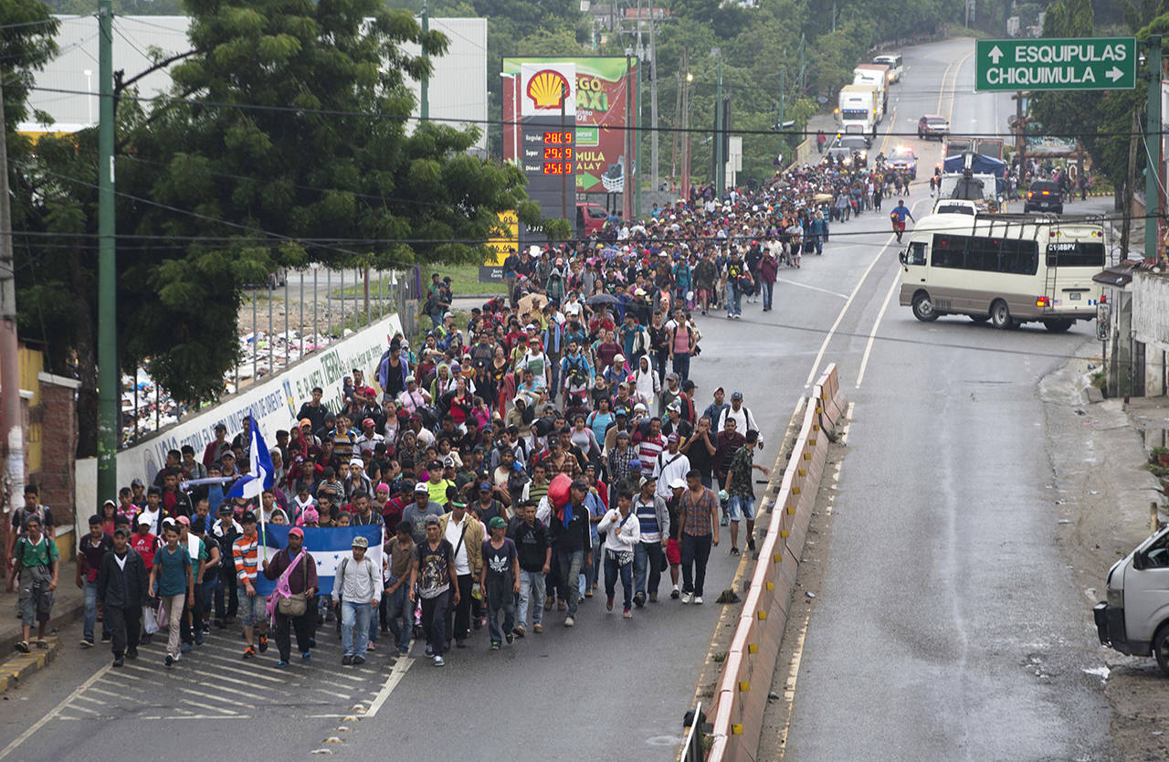Honduran migrants walking to the U.S. start their day departing Chiquimula, Guatemala, on Wednesday, Oct. 17. (AP Photo/Moises Castillo)