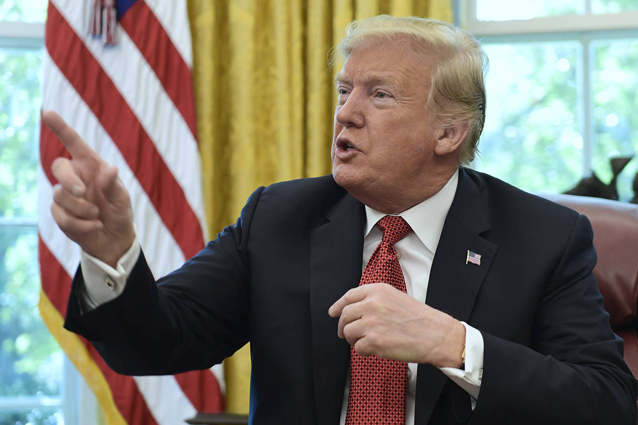 President Donald Trump speaks in the Oval Office of the White House on Wednesday during a meeting with workers. (AP Photo/Susan Walsh)
