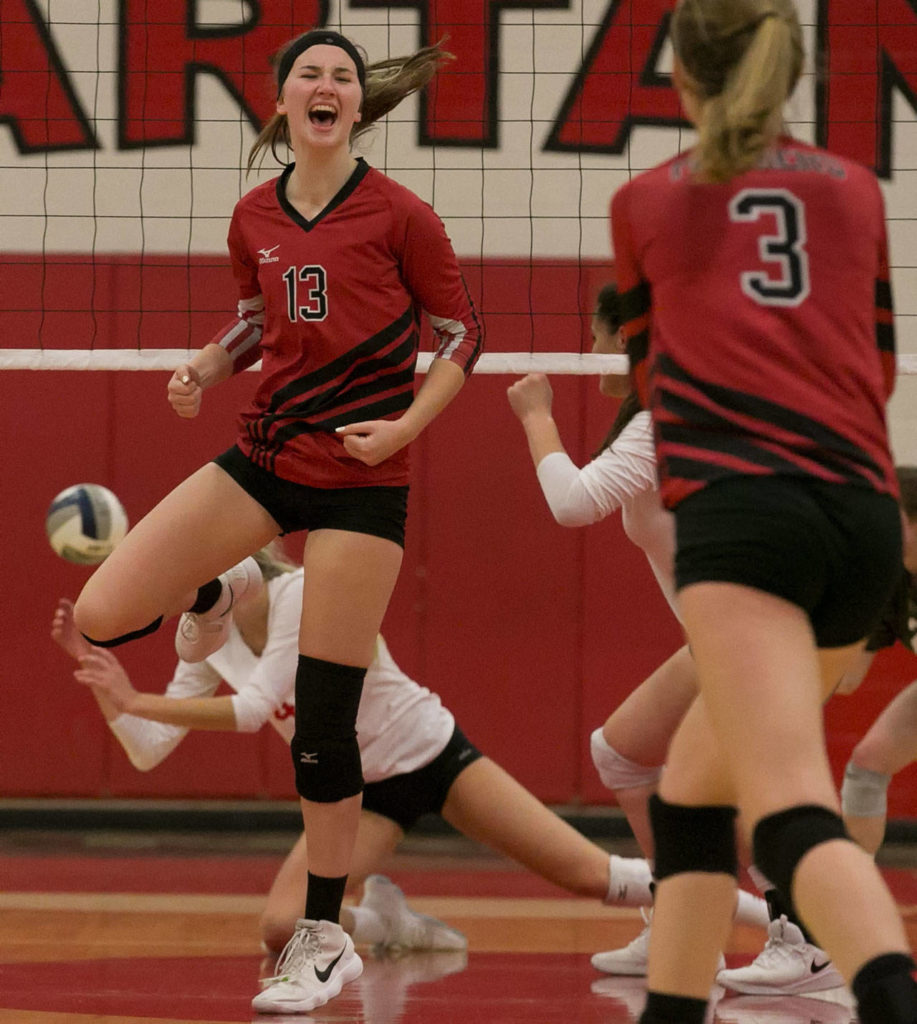 Snohomish’s MacKenzie Whyte celebrates a kill Thursday at Stanwood High School. (Kevin Clark / The Herald)
