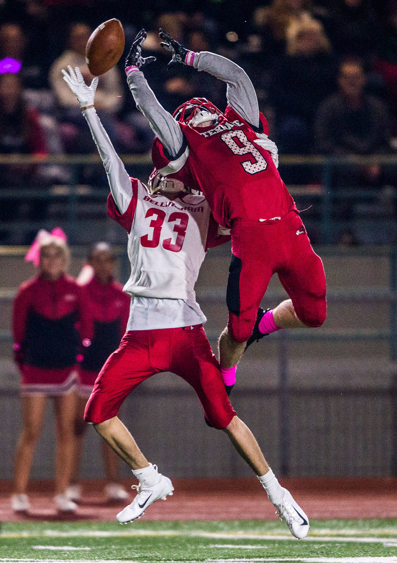 Mountlake Terrace’s Brandon Bach jumps above Bellingham’s Trey Clayton for a pass during a game on Oct. 12 in Edmonds. (Olivia Vanni / The Herald)