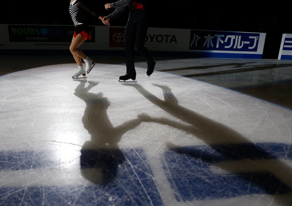Alisa Efimova and Alexander Karolin step onto the ice for the medal ceremony at the 2018 Skate America competition on Saturday at Angel of the Winds Arena in Everett. (Olivia Vanni / The Herald)
