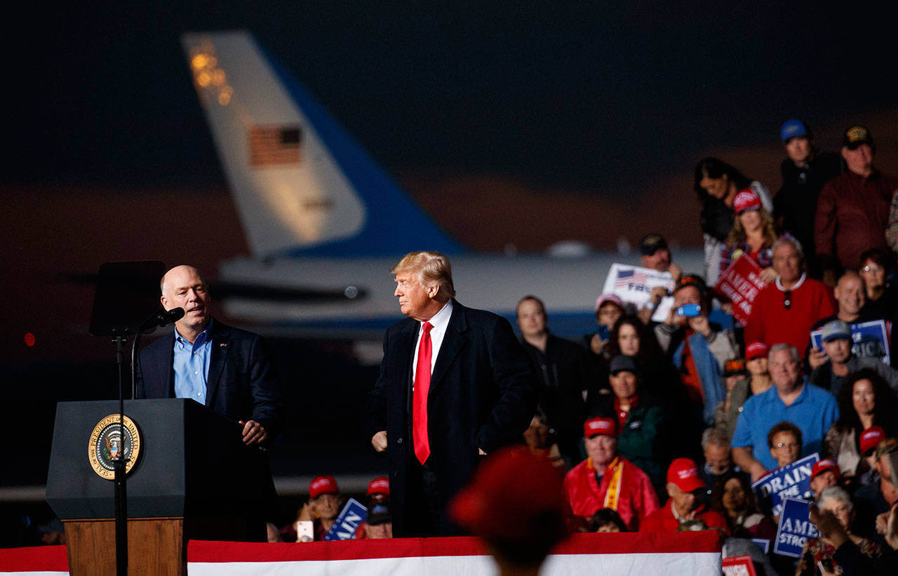 U.S. Rep. Greg Gianforte, R-Montana, speaks during a campaign rally with President Trump stands right at Minuteman Aviation Hangar, Thursday, in Missoula, Montana. (Carolyn Kaster/Associated Press)