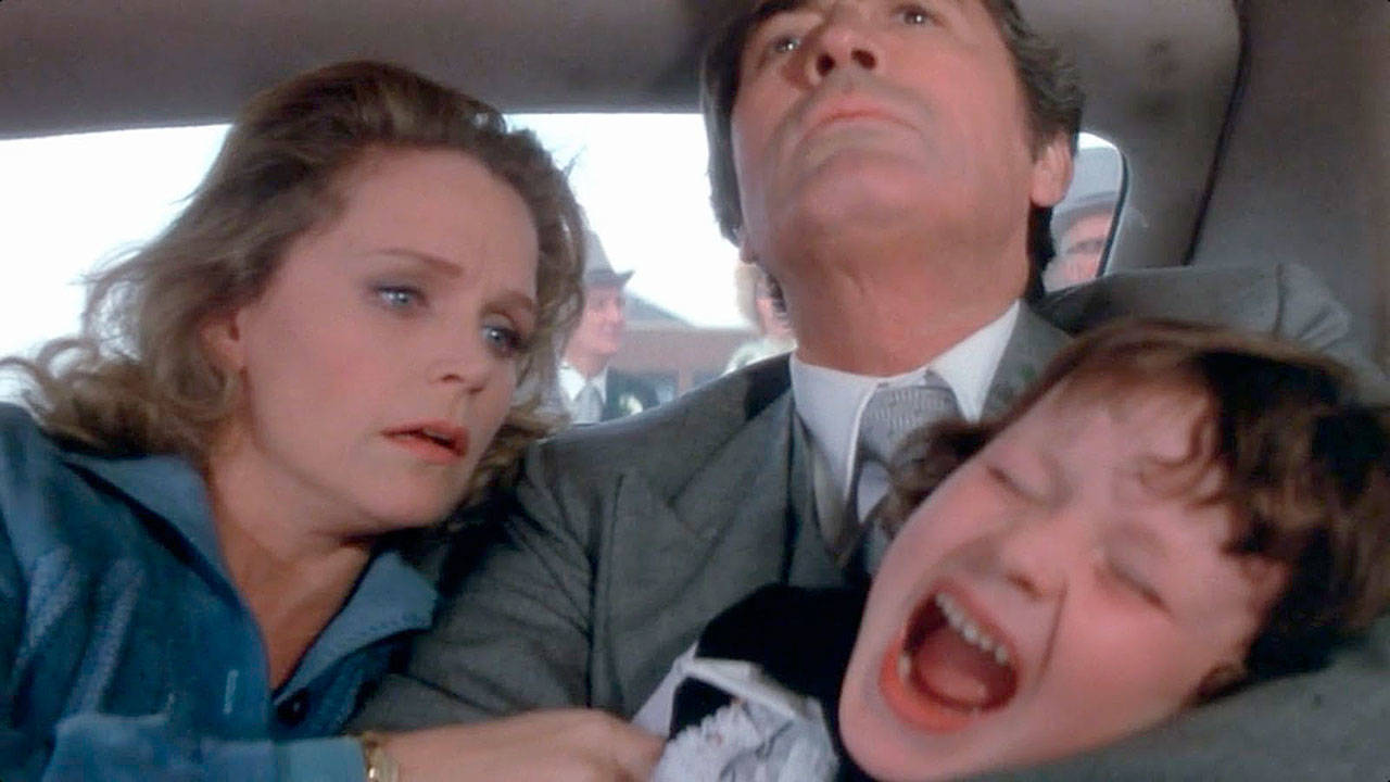 Damien (Harvey Stephens) throws a devil of a tantrum over going to church, much to the consternation of parents Lee Remick and Gregory Peck, in “The Omen,” the 1976 horror classic. (Paramount Pictures)