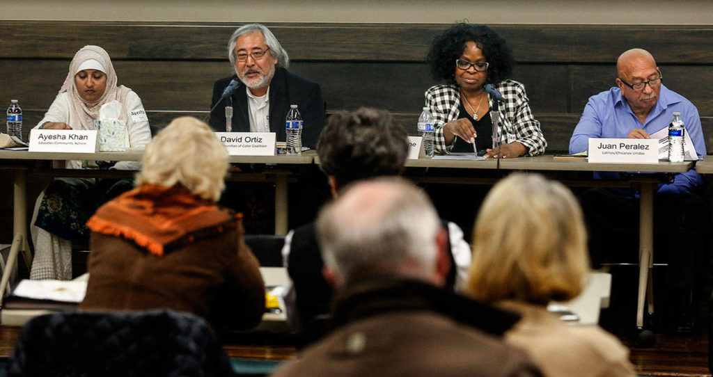From left, Ayesha Khan, David Ortiz, Janice Greene and Juan Peralez, as well as Kathy Coffey and Cameron Calder (not pictured) are a diverse panel at Wednesday night’s Civil Discourse Forum at Everett Community College. (Dan Bates / The Herald)
