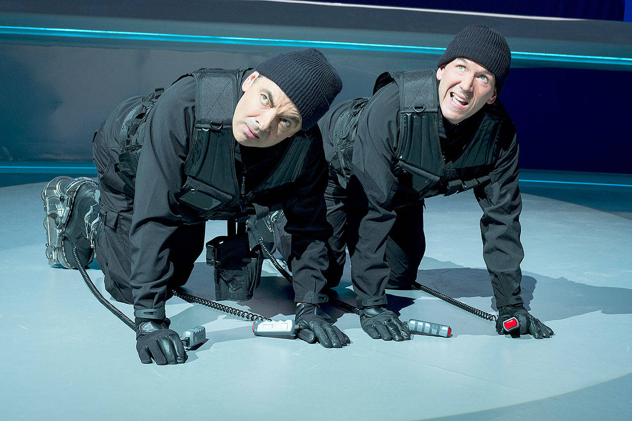 Rowan Atkinson (left) and Ben Miller size up the situation in Johnny English Strikes Again. (Focus Features)