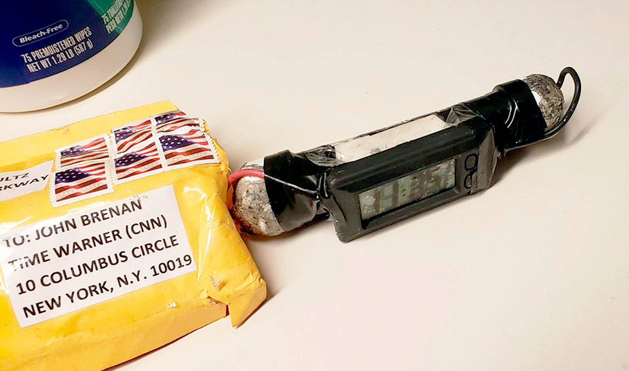 A package addressed to former CIA head John Brennan and an explosive device that was sent to CNN’s New York office. (ABC News via AP)