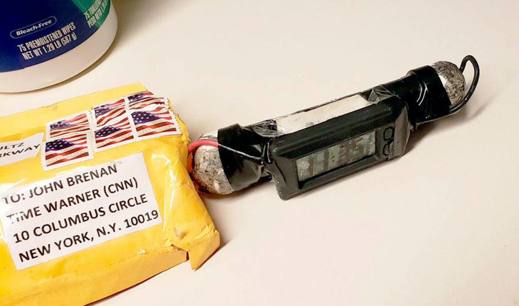 A package addressed to former CIA head John Brennan and an explosive device that was sent to CNN’s New York office. (ABC News via AP) 
