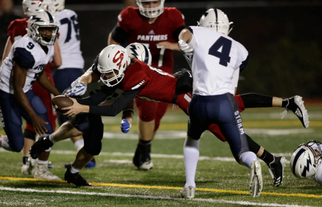 Snohomish’s Tayte Conover dives in for a touchdown during the Panthers’ 30-27 win over Squalicum on Fridayat Veterans Memorial Stadium in Snohomish. (Andy Bronson / The Herald)
