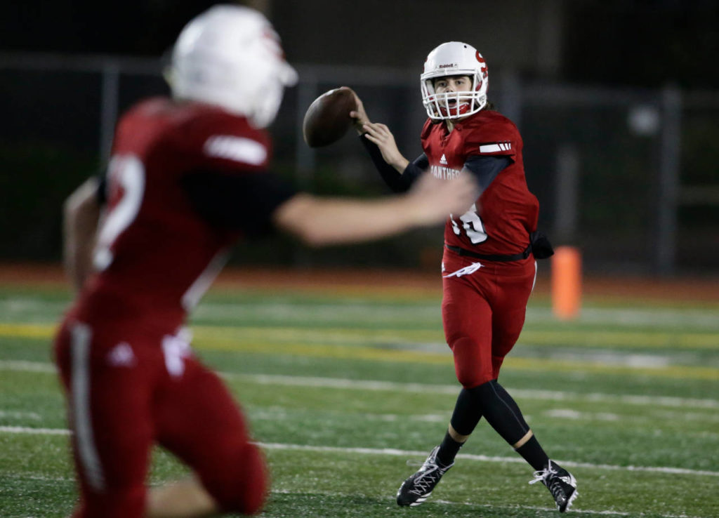 Snohomish’s Tayte Conover looks for receiver Ryan Douglas during the Panthers’ 30-27 win over Squalicum on Friday at Veterans Memorial Stadium in Snohomish. (Andy Bronson / The Herald)
