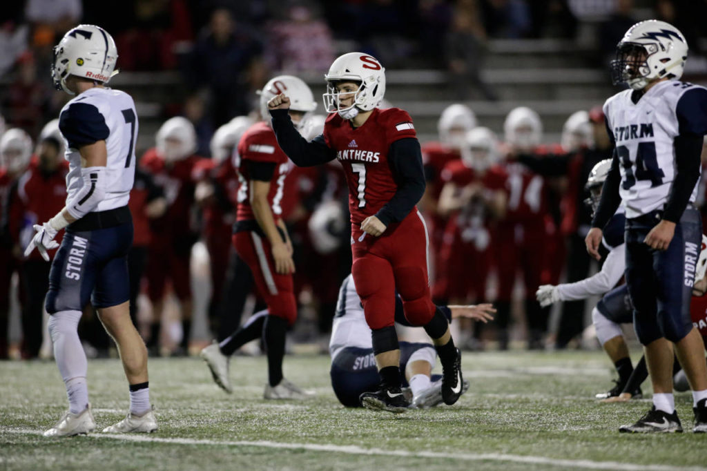 Snohomish’s Kyler Hammer (7) raises a fist after kicking a field goal during the Panthers’ 30-27 win over Squalicum Friday night at Veterans Memorial Stadium in Snohomish. (Andy Bronson / The Herald)
