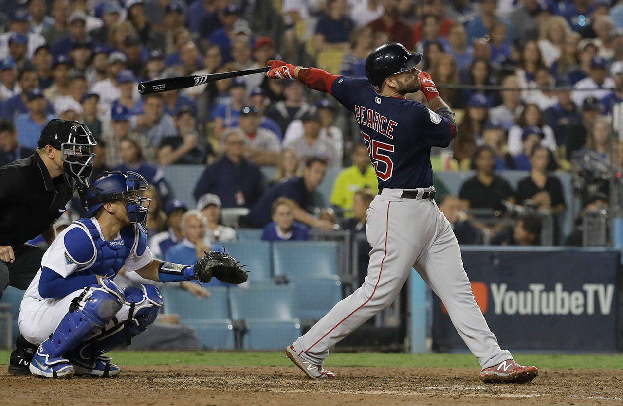 David J. Phillip / Associated Press                                Boston’s Steve Pearce hits a home run during the eighth inning of Game 4 of the World Series on Saturday in Los Angeles.