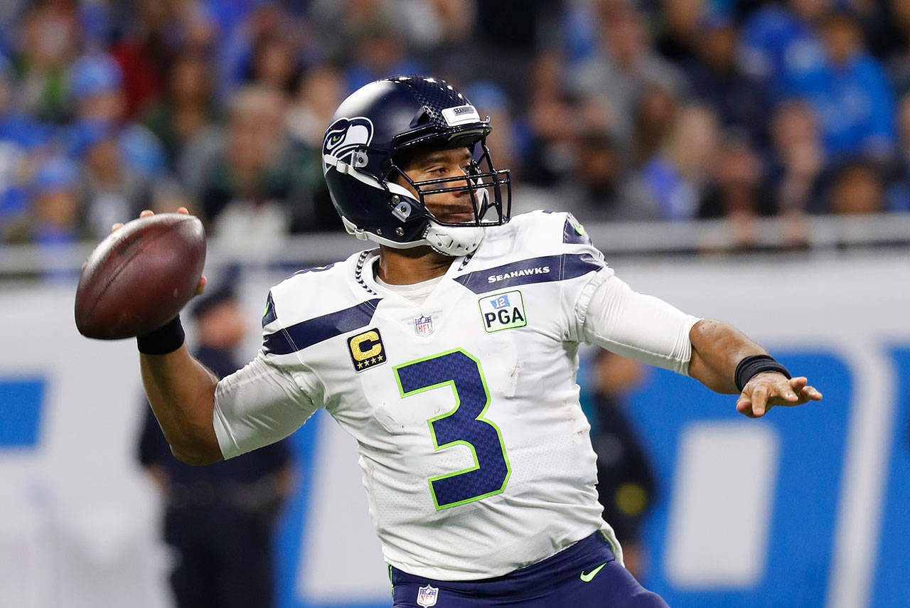 Seahawks quarterback Russell Wilson completed 14 of 17 passes for 248 yards and three touchdowns Sunday in a 28-14 win over the Detroit Lions. (AP Photo/Paul Sancya)